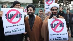Iranian men hold placards during a demonstration outside the Tehran Research Reactor in the capital Tehran on November 23, 2014, to show their support to Iran's nuclear programme. Iran and six world powers are holding talks in Vienna to reach a lasting agreement on Tehran's disputed nuclear programme before November 24. Such a deal, after 12 years of rising tensions, is aimed at easing fears that Tehran will develop nuclear weapons under the guise of its civilian activities -- an ambition the Islamic republic has always fiercly denied. AFP PHOTO/ATTA KENAREATTA KENARE/AFP/Getty Images