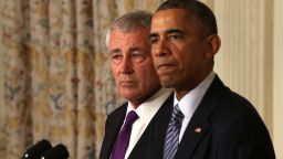 WASHINGTON, DC - NOVEMBER 24:  U.S. President Barack Obama (R) speaks as Secretary of Defense Chuck Hagel looks on during a press conference announcing Hagel's resignation in the State Dining Room of the White House November 24, 2014 in Washington, DC. Sources say Hagel plans to remain in office until his successor is confirmed by the Senate.  (Photo by Alex Wong/Getty Images)