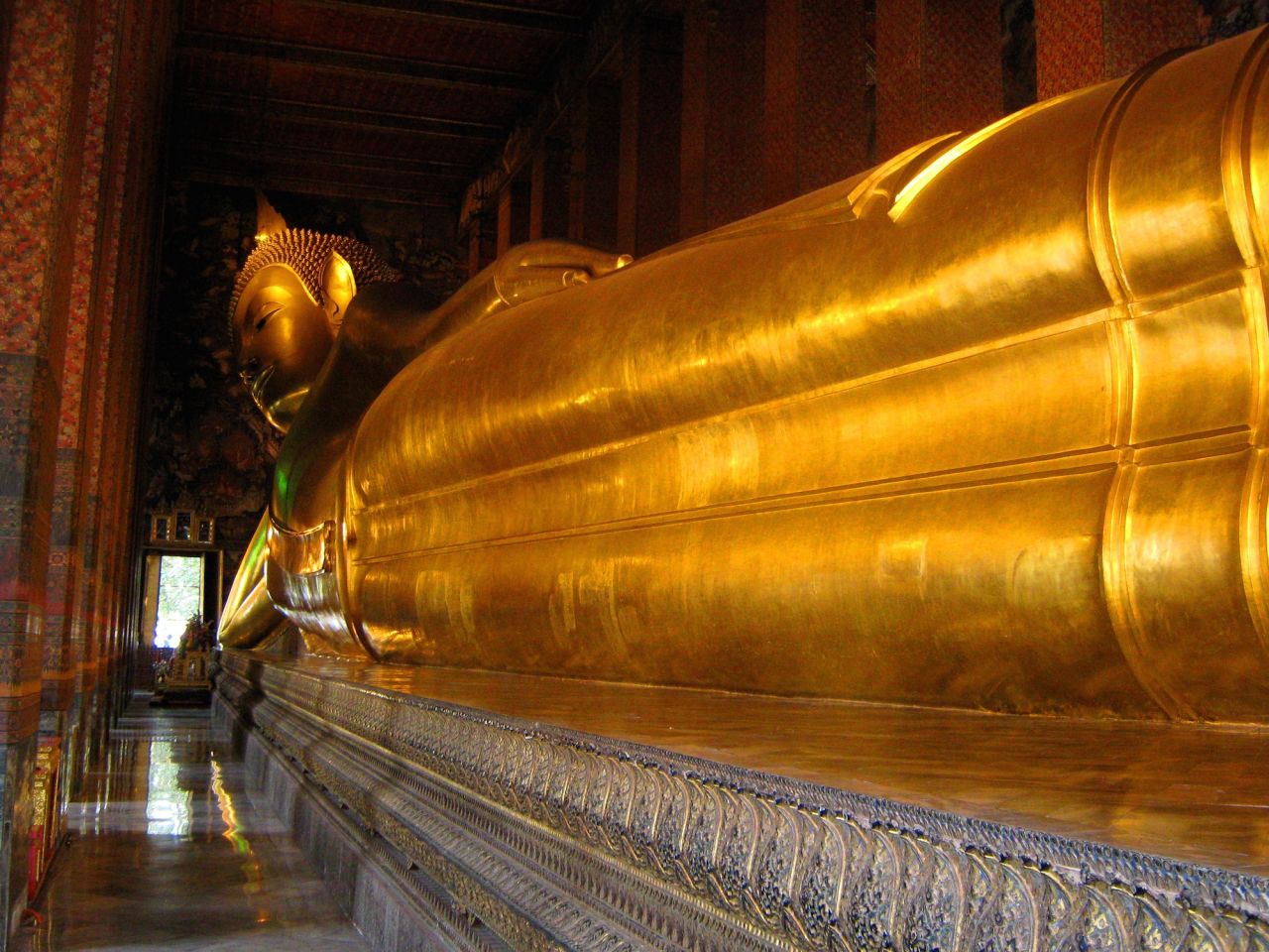 Located in Bangkok Wat Pho temple complex, this reclining Buddha measures 15 meters high and 43 meters long. 