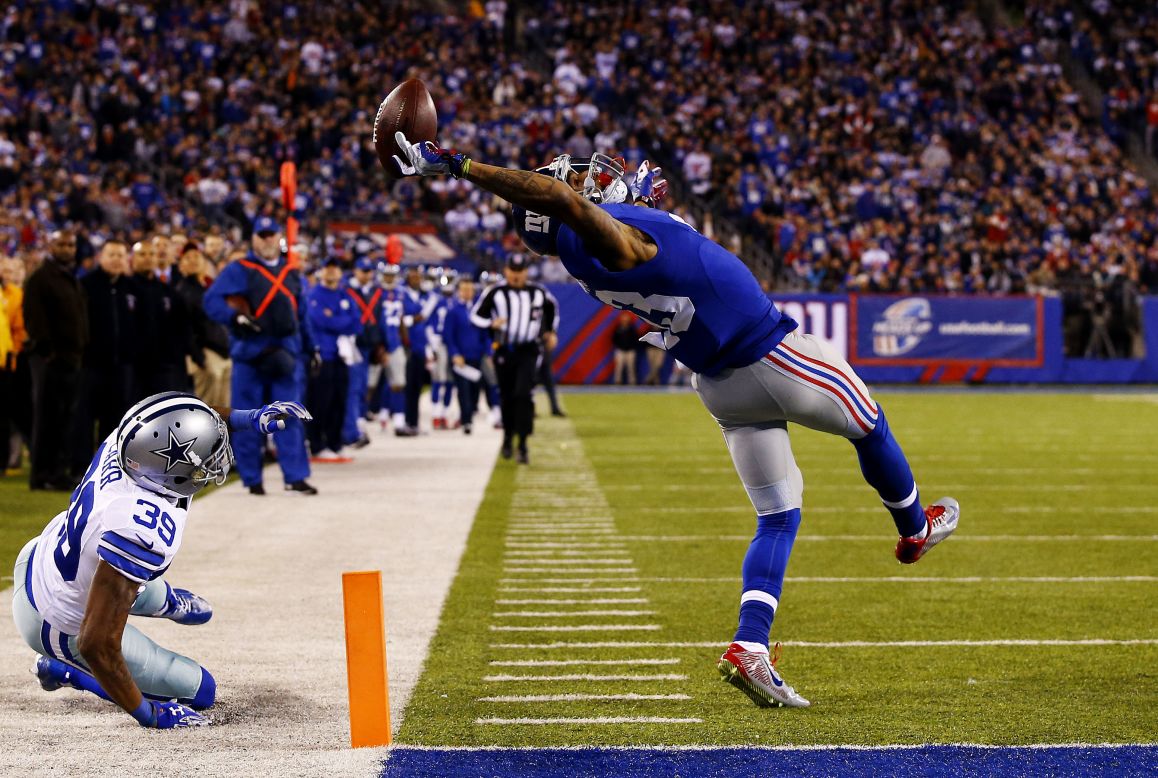 New York Giants wide receiver Odell Beckham Jr. makes a spectacular one-handed touchdown grab Sunday, November 23, in East Rutherford, New Jersey. The highlight gave the Giants an early first-half lead against Dallas, but their NFC East rivals came back to win 31-28.