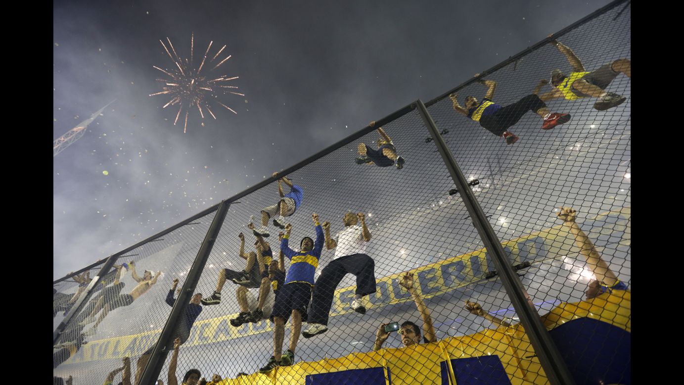 Fans of the Argentine soccer club Boca Juniors cheer before the start of a match against River Plate on Thursday, November 20, in Buenos Aires. <a href="http://www.cnn.com/2014/11/18/worldsport/gallery/what-a-shot-1118/index.html">See 39 amazing sports photos from last week</a>
