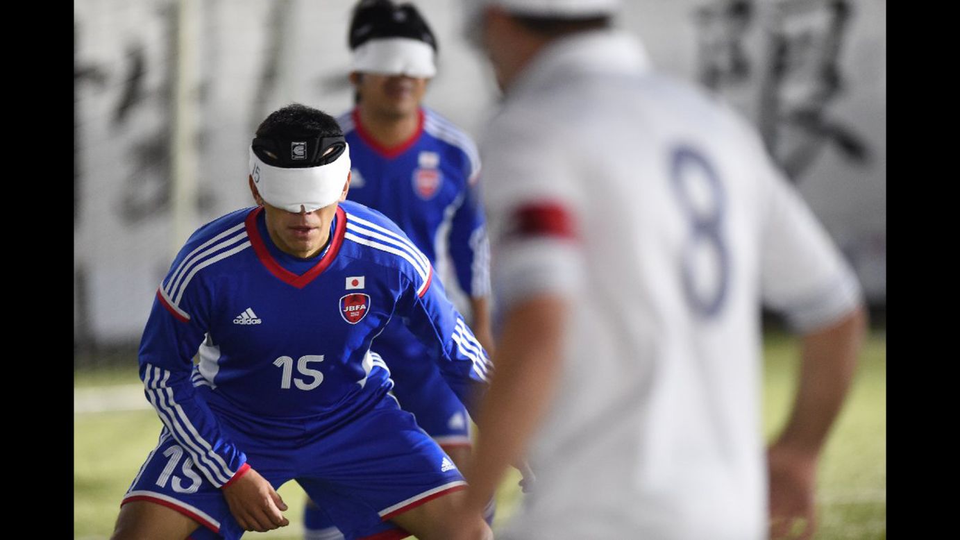 Japanese soccer player Roberto Izumi Sasaki, left, takes on France during a five-a-side match Wednesday, November 19, at the Blind Football World Championships. Japan qualified for the next round after a 1-1 draw.