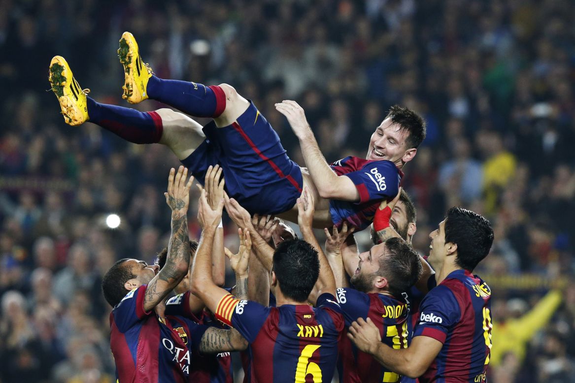 Barcelona players lift Lionel Messi on Saturday, November 22, after he broke the record for career goals in La Liga, the top tier in Spanish soccer. Messi has scored 253 league goals, with his latest three coming in Barcelona's 5-1 home victory over Sevilla.