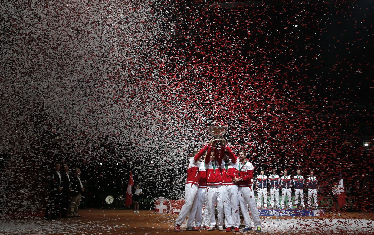 Swiss tennis players celebrate after they defeated France in the Davis Cup final Sunday, November 23, in Lille, France. It was the first Davis Cup the country has ever won.
