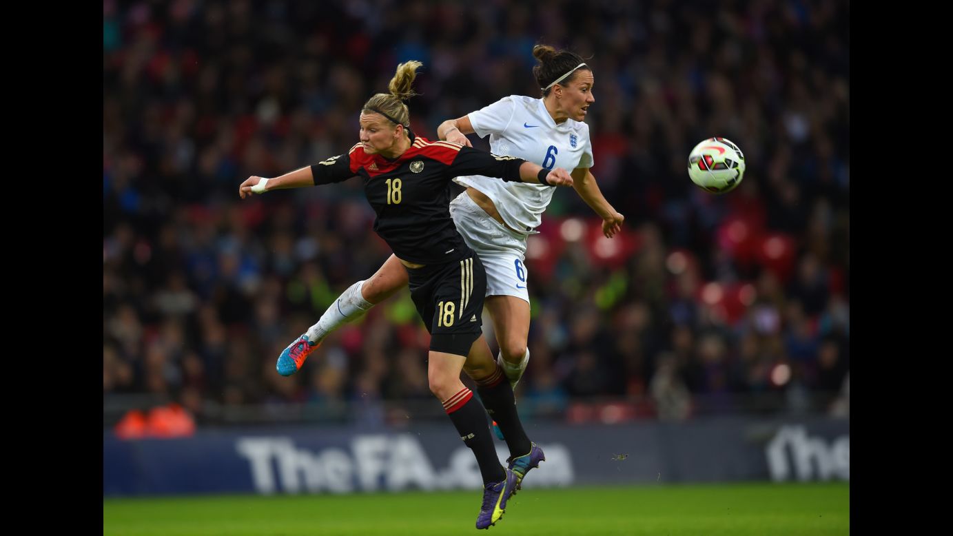Germany's Alexandra Popp, left, and England's Lucy Bronze compete for the ball during an international friendly match in London on Sunday, November 23.