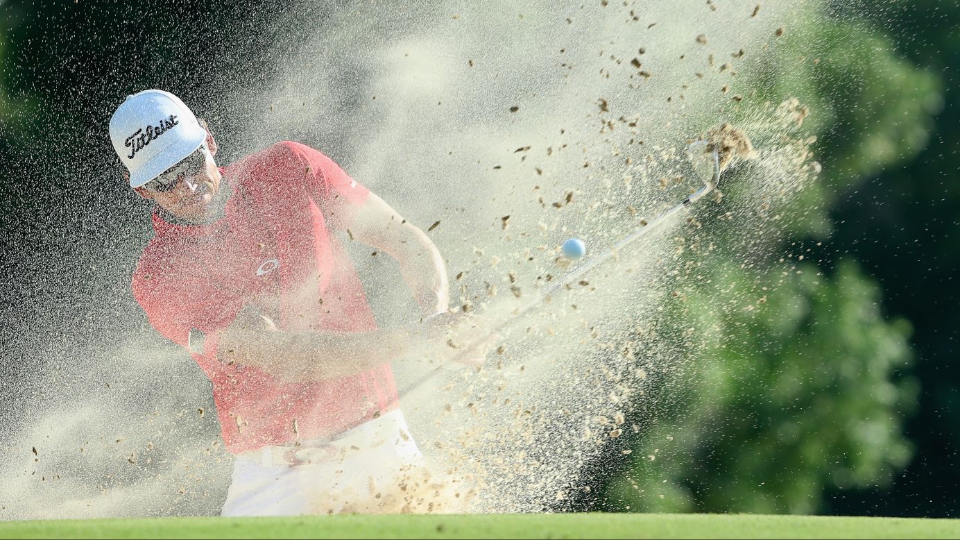 Rafa Cabrera-Bello blasts a ball out of the bunker on Sunday, November 23, during the final round of the DP World Tour Championship in Dubai, United Arab Emirates.