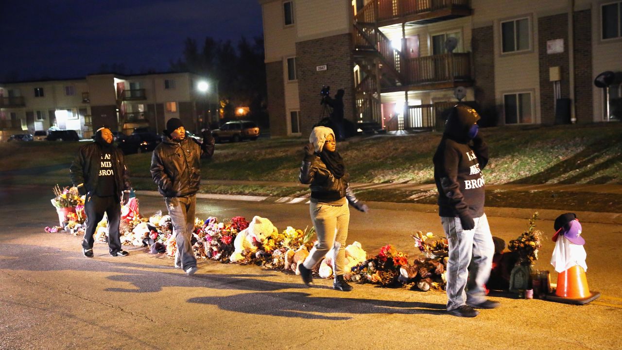 Residents begin to gather at the Michael Brown memorial ahead of the grand jury announcement.