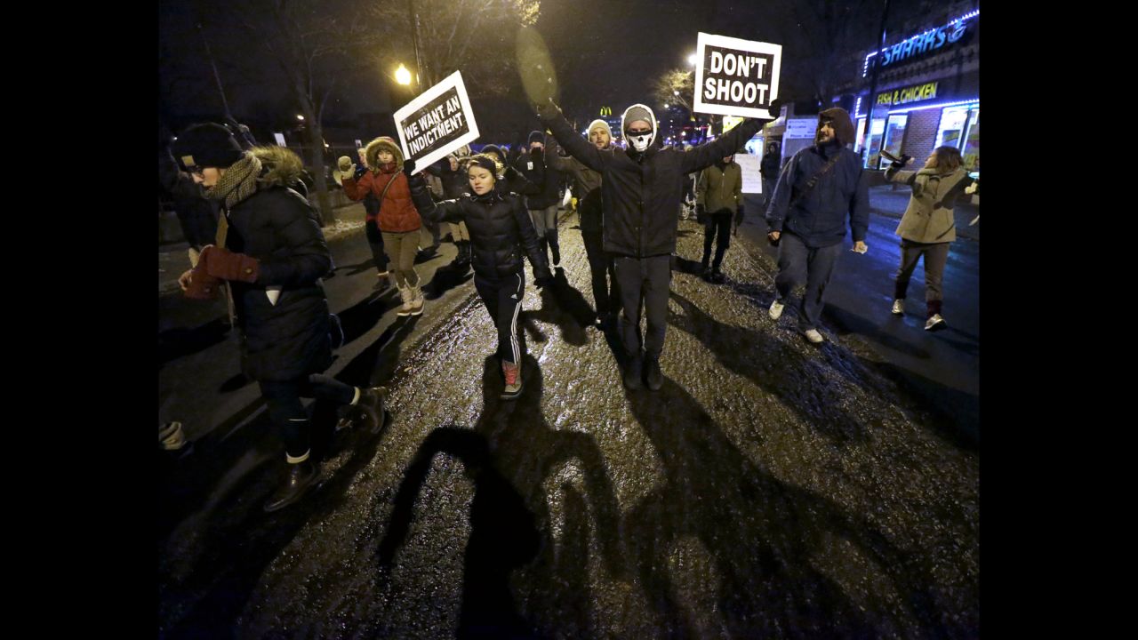 Protesters march near Chicago police headquarters on November 24.