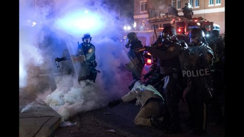 Riot police clash with protesters on November 24.