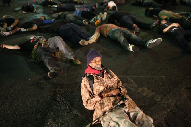 Protesters in Los Angeles lie down in a major intersection to block traffic on November 24.