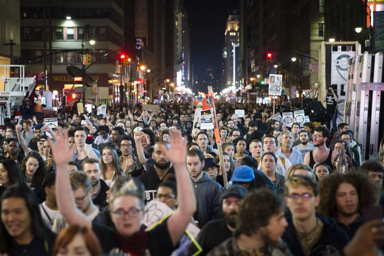 Protesters march up New York's Seventh Avenue on Monday, November 24. 