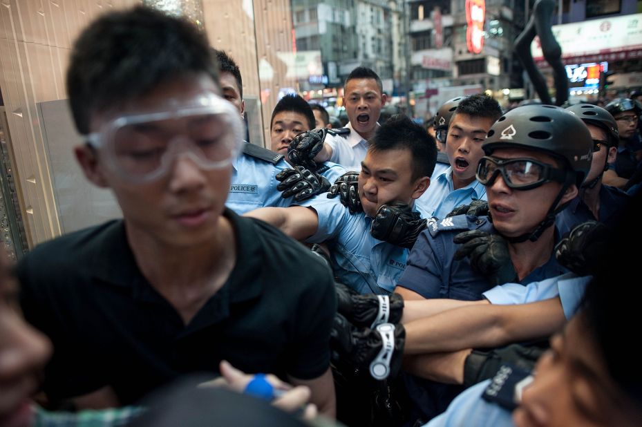 Police try to arrest a protester on November 25. 