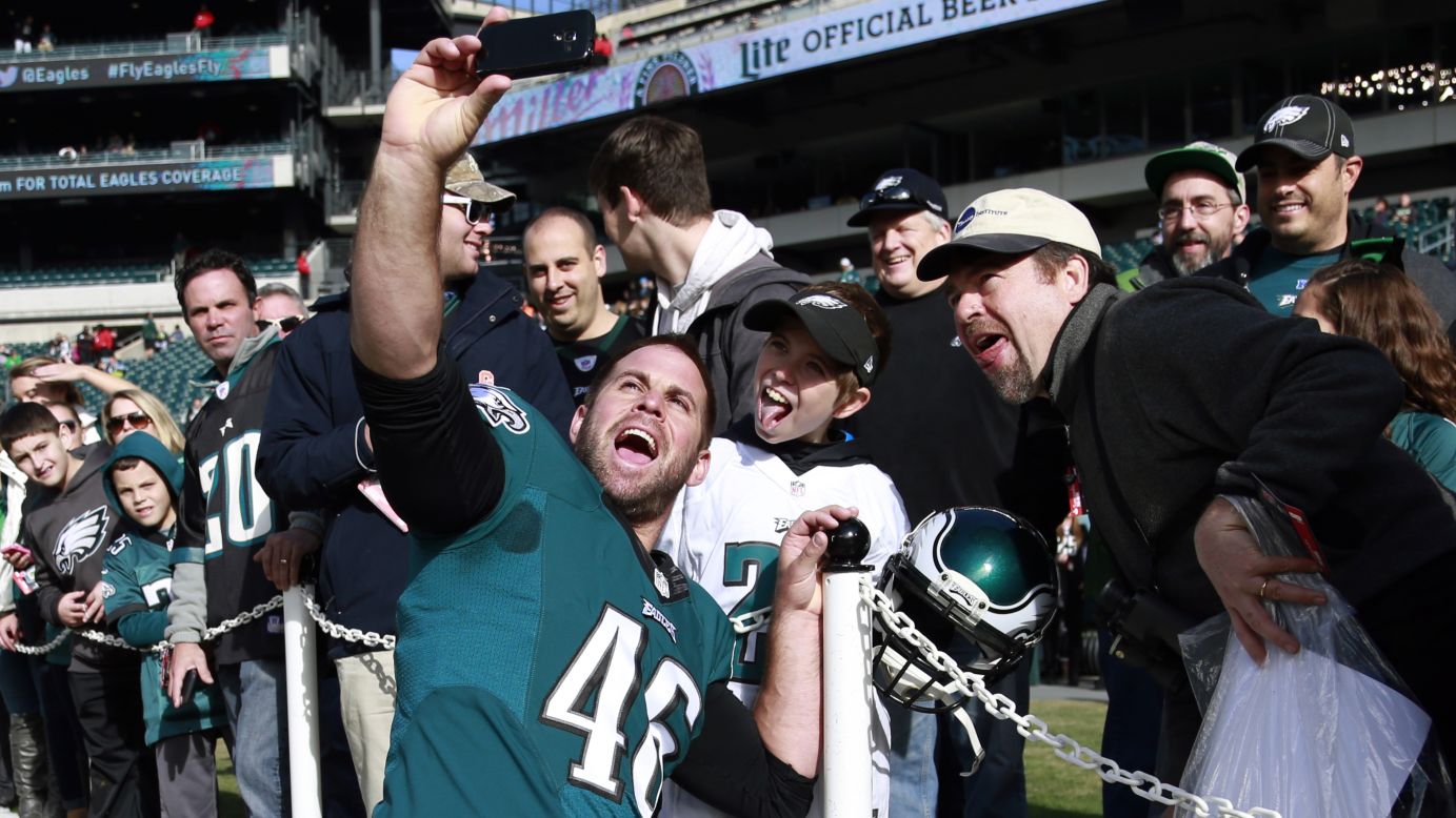 Jon Dorenbos, a long snapper for the NFL's Philadelphia Eagles, snaps a selfie with home fans before taking on the Tennessee Titans on Sunday, November 23.