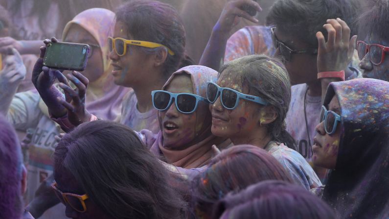 People take a selfie during the Color Run event in Jakarta, Indonesia, on Sunday, November 23. During the race, which is billed as "the happiest 5K on the planet," participants are doused with colored powder.