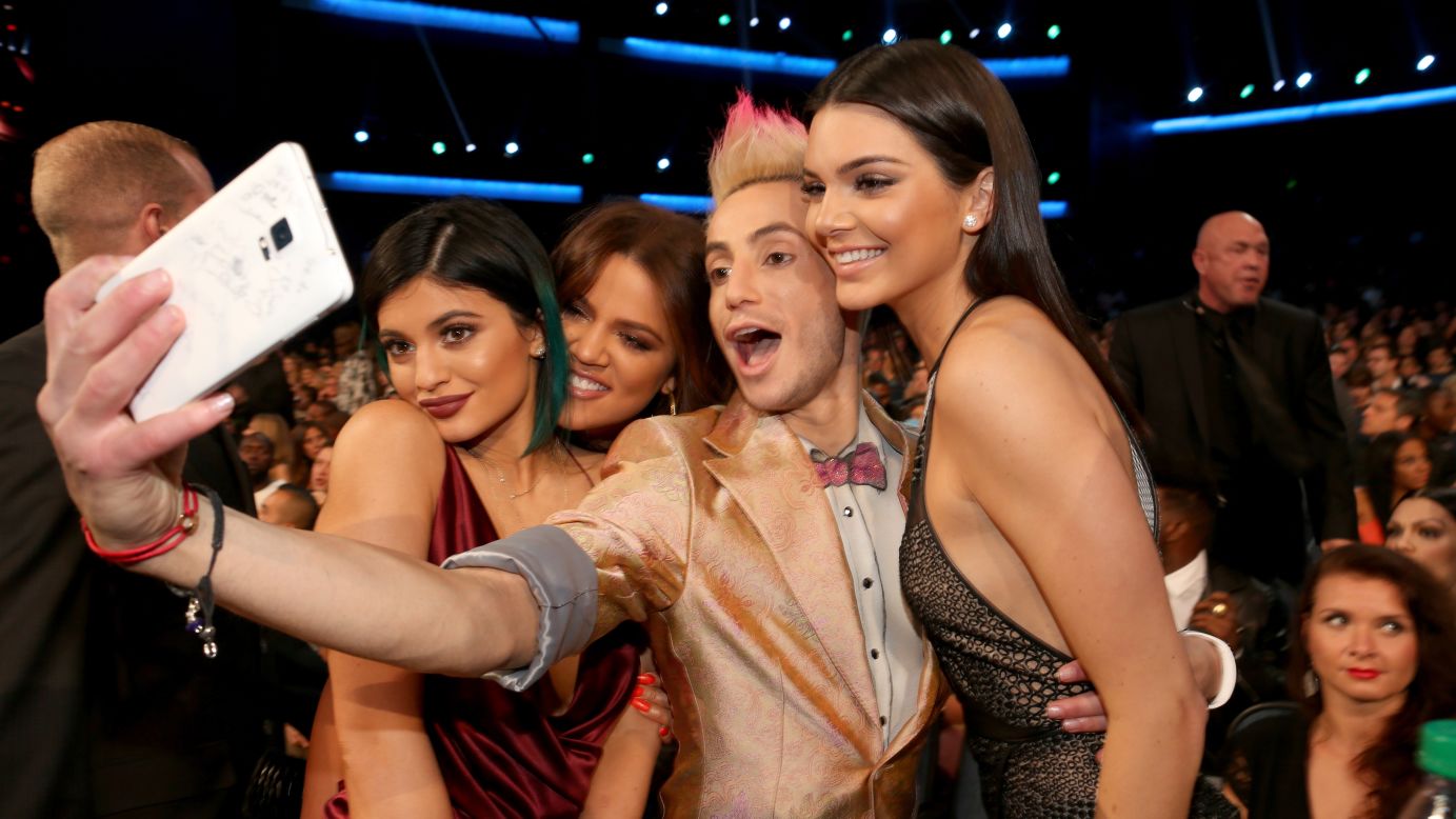 Frankie Grande, brother of pop star Ariana Grande, takes a selfie with television personalities Kylie Jenner, Khloe Kardashian and Kendall Jenner at the American Music Awards on Sunday, November 23.