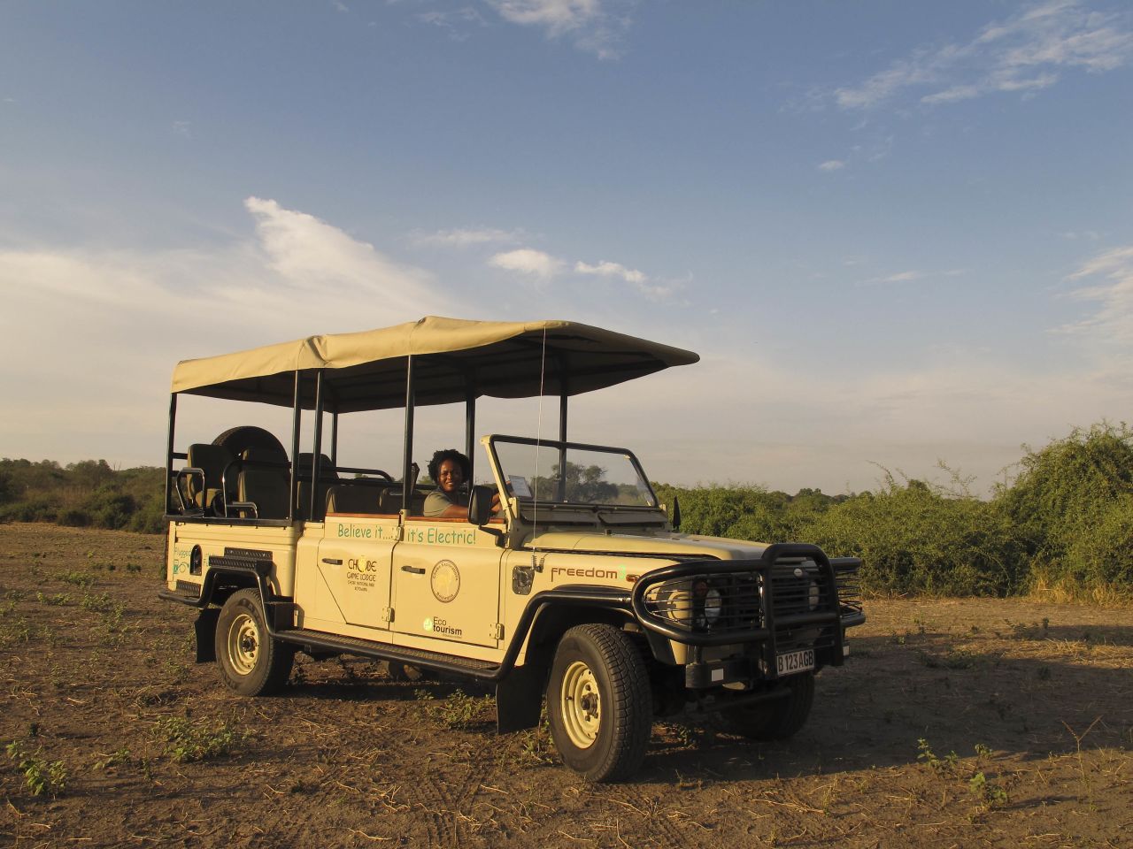 Guide Lebo behind the wheel of Chobe Game Lodge's first electric game viewing vehicle.