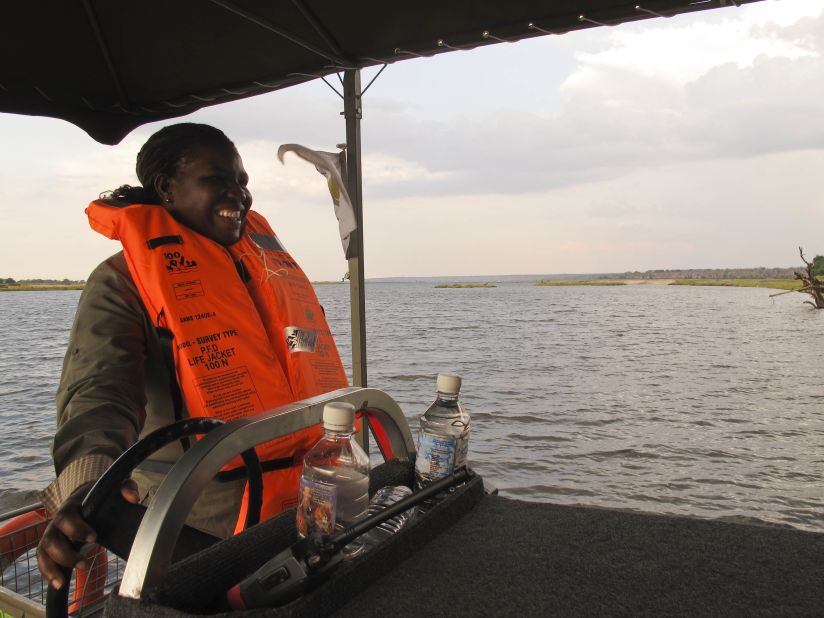 Connie, a guide at Chobe Game Lodge, behind the wheel of their new electric boat on the Chobe River in Botswana. The lodge has an all-female guiding team.