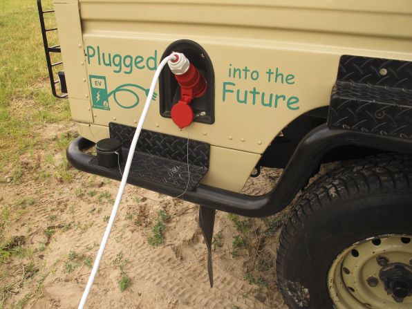 "Fueling up" the Land Rover, now using electric power from the Victoria Falls hydroelectric grid instead of diesel.