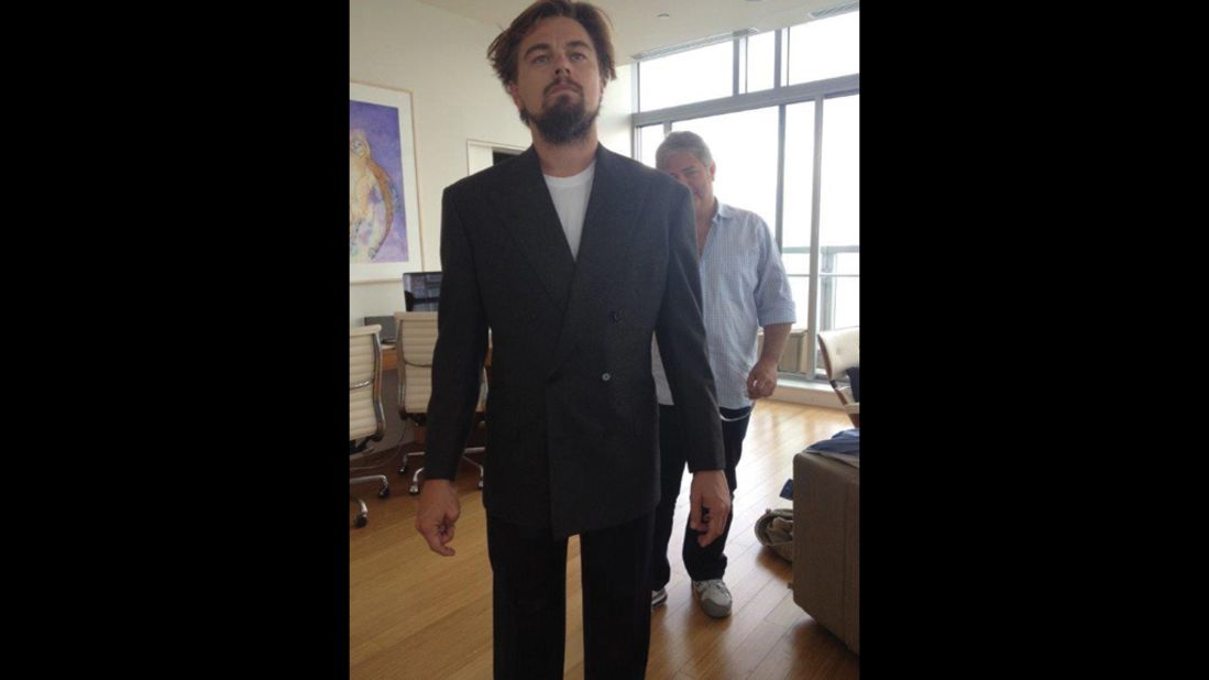 He's designed suits for a number of movie stars, including Paul Newman, Ben Affleck, and Leonardo DiCaprio -- seen here being fitted for a <em>Wolf of Wall Street</em> costume.