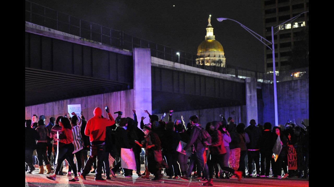 Protesters block all lanes of Interstate 75/85 northbound near the Georgia state Capitol in Atlanta on November 25.