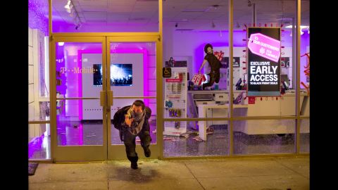 Businesses were looted in Oakland on November 25, including a T-Mobile store.
