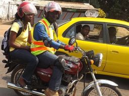 Harris Kollie (pictured on his motorbike) has been driving customers around Monrovia since 2005.