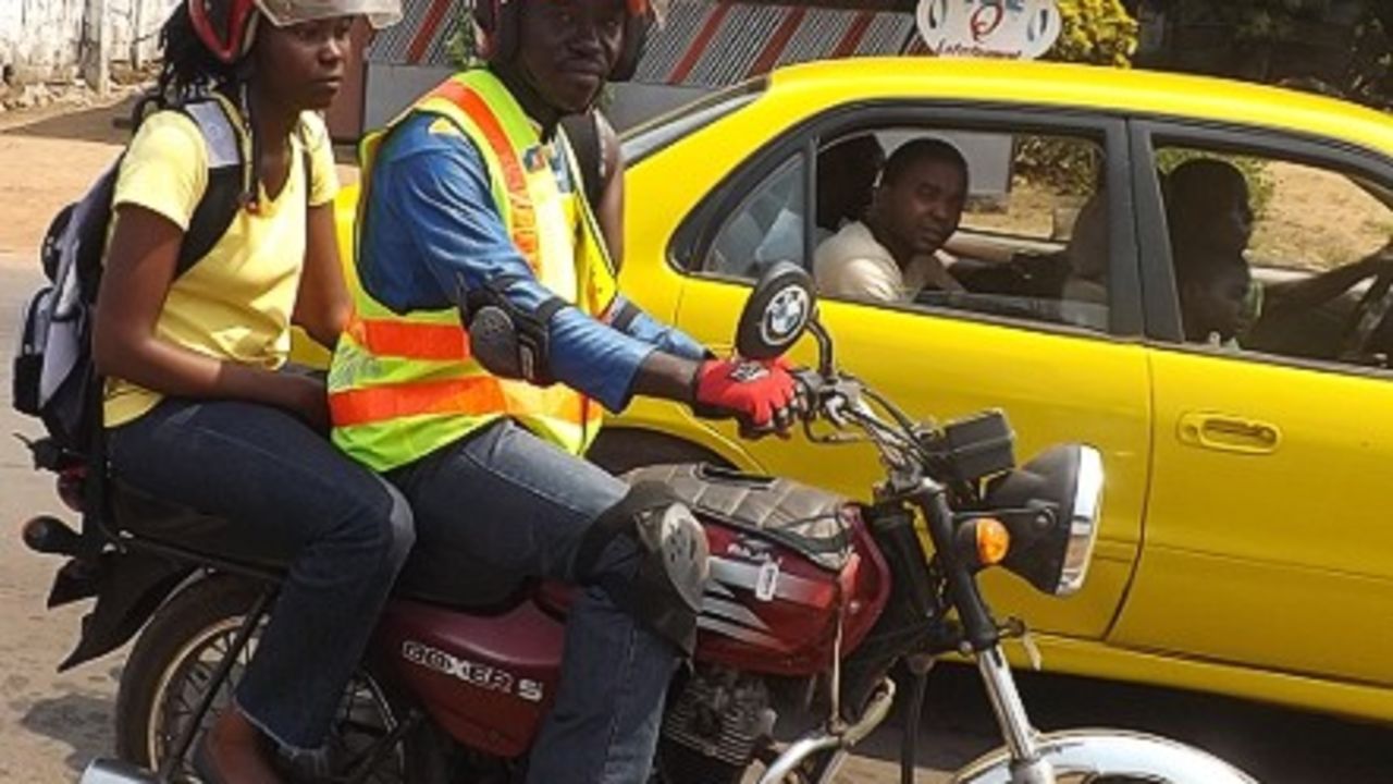Harris Kollie (pictured on his motorbike) has been driving customers around Monrovia since 2005.