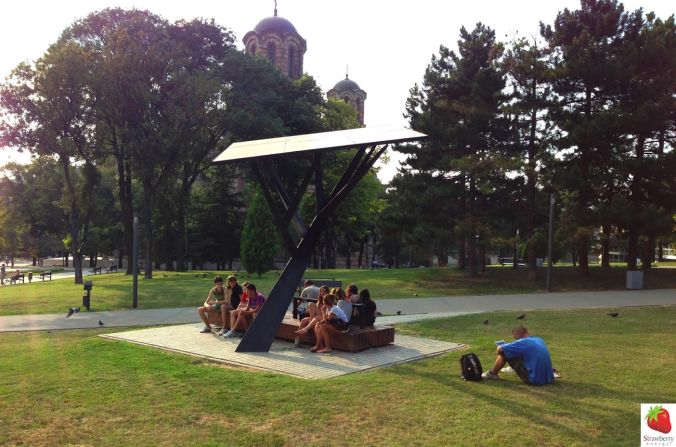 The Strawberry Tree is a public solar-powered station that allows users to recharge their mobile phones for free. 