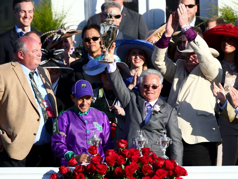 California Chrome's trainer Art Sherman (right) became the oldest trainer to win the Kentucky Derby at the age of 77. 