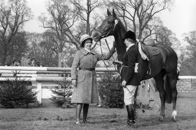 A "well done" pat for Doublet as the Queen congratulates Princess Anne and her mount after they had taken fifth place in the 1975 Badminton Horse Trials.
