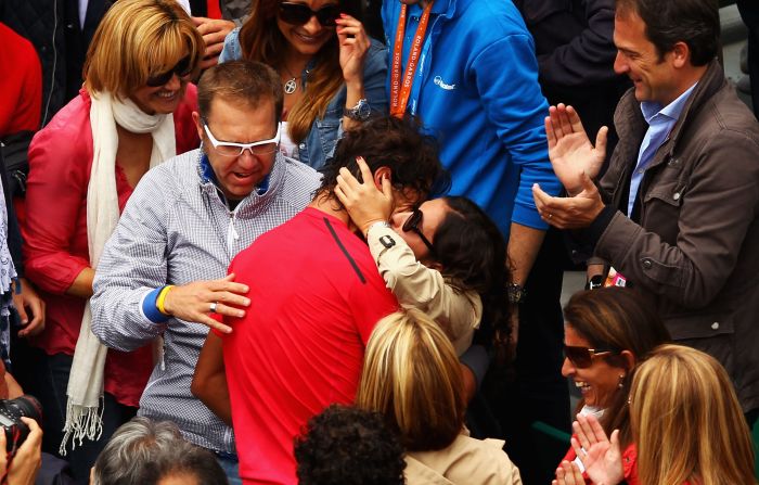 Nadal and his longtime girlfriend make a rare public display of affection at the French Open.