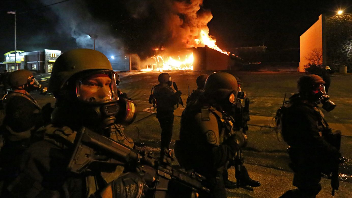 Members of the St. Louis County Police Department arrive to disperse a crowd Monday, November 24, in Ferguson, Missouri. <a href="http://www.cnn.com/2014/11/24/justice/gallery/ferguson-reaction/index.html">Chaos erupted in Ferguson</a> after a grand jury decided not to indict Darren Wilson, a white police officer who shot unarmed black teenager Michael Brown in August. <a href="http://www.cnn.com/2014/11/25/us/ferguson-tension-moments/index.html">Buildings were burned and shops were looted</a> as protesters took to the streets to show their displeasure.