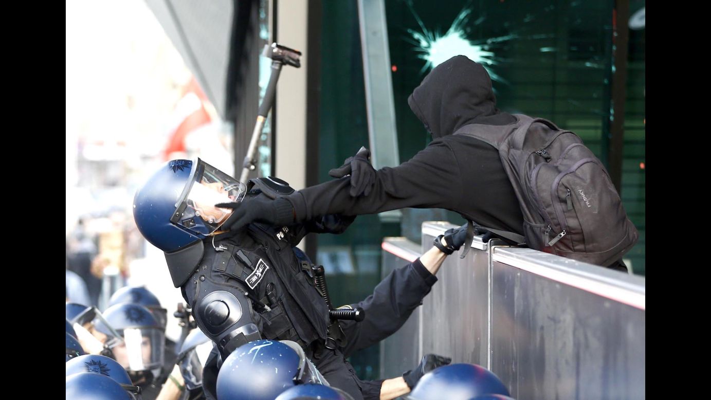 Riot police in Frankfurt, Germany, clash with protesters in front of the new headquarters of the European Central Bank on Saturday, November 22.