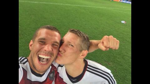 German soccer player Lukas Podolski <a href="https://twitter.com/Podolski10/status/488445583104155648/photo/1" target="_blank" target="_blank">gets a kiss</a> from teammate Bastian Schweinsteiger as they celebrate their World Cup victory Sunday, July 13, in Rio de Janeiro. <a href="http://www.cnn.com/2014/07/13/worldsport/gallery/world-cup-final-germany-argentina-2014/index.html">Germany defeated Argentina 1-0 in extra time</a> for the country's fourth World Cup title.