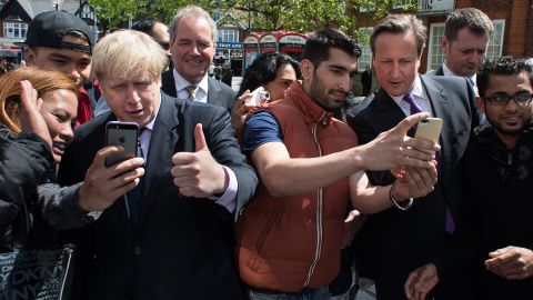 London Mayor Boris Johnson, third from left, and British Prime Minister David Cameron, third from right, take selfies with locals as they campaign in London on Monday, May 12. Cameron <a href="http://www.standard.co.uk/news/politics/david-cameron-selfie-craze-makes-campaigning-take-a-lot-longer-9361937.html" target="_blank" target="_blank">told the London Evening Standard</a> that the selfie craze these days makes campaigning take longer. "You can be walking down the street for a chat, but until you've got the selfie out of the way people aren't ready to talk," he said.