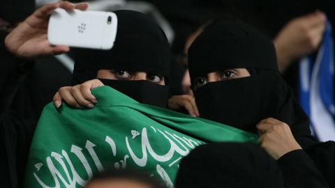 Women take a selfie as they attend a soccer match in Al Ain, Saudi Arabia, on Tuesday, September 30.