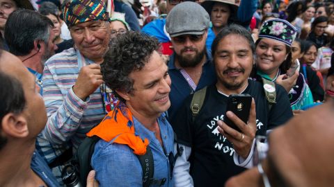 Actors Mark Ruffalo (curly hair) and Leonardo DiCaprio (sunglasses) join the People's Climate March in New York on Sunday, September 21. Thousands of demonstrators filled the streets of Manhattan as they urged policymakers to take global action on climate change.