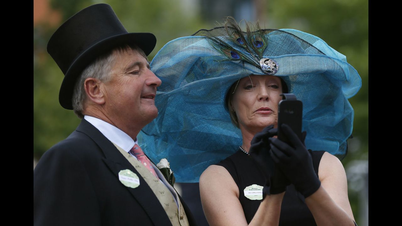 Peter Foster and Gillian Kirby take a selfie on the second day of the Royal Ascot horse-racing event Wednesday, June 18, in Ascot, England.