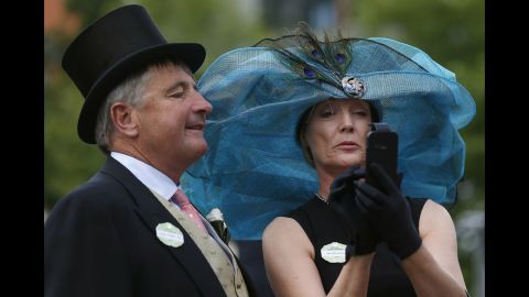 Peter Foster and Gillian Kirby take a selfie on the second day of the Royal Ascot horse-racing event Wednesday, June 18, in Ascot, England.