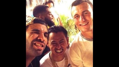 Rapper Drake, left, <a href="http://instagram.com/p/pQcF4rjQJL/" target="_blank" target="_blank">snaps a photo</a> with football star Johnny Manziel, right, on Sunday, June 15. "Aggie life," he wrote, referring to Manziel's school, Texas A&M.