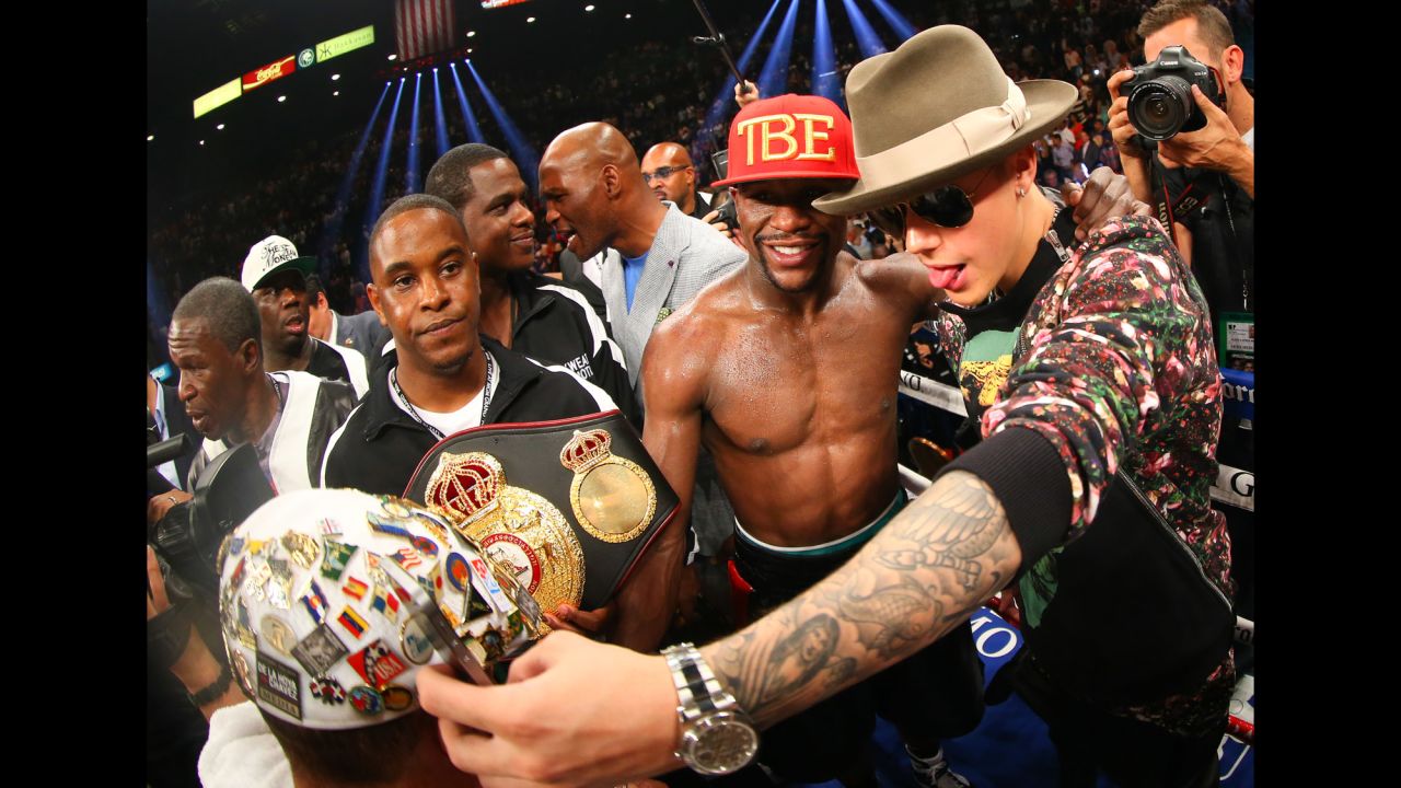 Boxing champion Floyd Mayweather Jr. poses with pop star Justin Bieber after defeating Marcos Maidana in Las Vegas on Saturday, May 3.