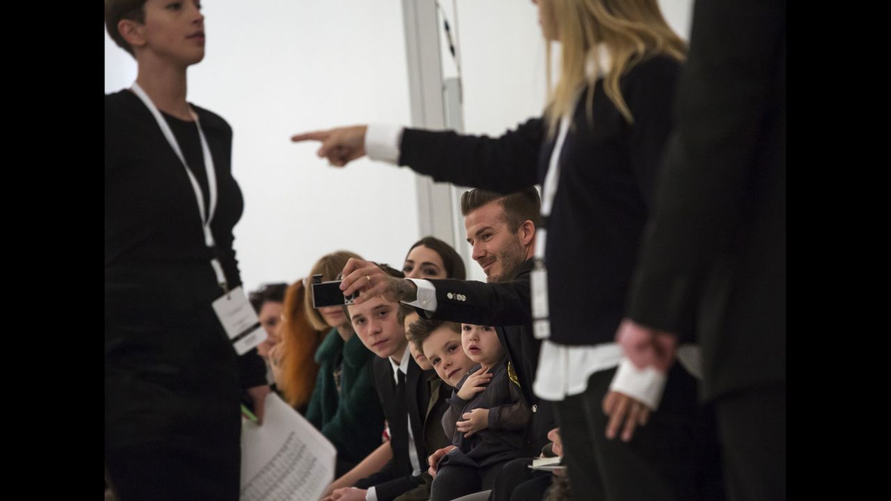 Former <a href="http://www.cnn.com/2013/02/01/showbiz/gallery/david-beckham-through-years/index.html">soccer star David Beckham</a> takes a selfie with his children before his wife's fashion show in New York on Sunday, February 9.