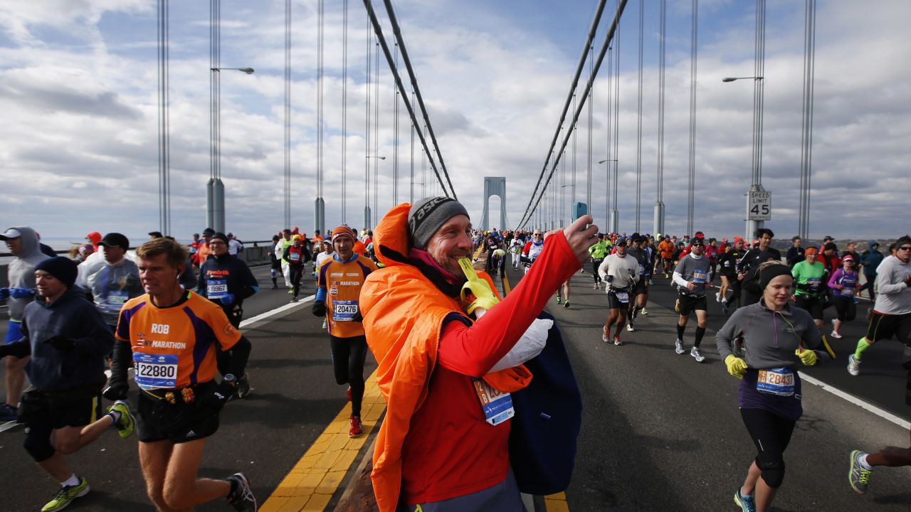 A runner stops to take a selfie Sunday, November 2, as he crosses the Verrazano-Narrows Bridge at the start of the New York City Marathon.