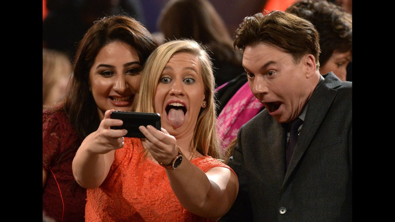 Extreme close-up! Actor Mike Myers harkens back to his <a href="https://www.youtube.com/watch?v=kdz3rHmQbsw" target="_blank" target="_blank">"Wayne's World" days</a> as he takes a selfie with guests at the Hollywood Film Awards on Friday, November 14.