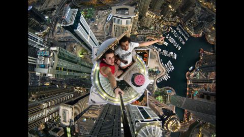Russian daredevils Alexander Remnev, left, and Volodya Sidorov take a selfie Thursday, January 30, after scaling the Princess Tower, a skyscraper in Dubai, United Arab Emirates.