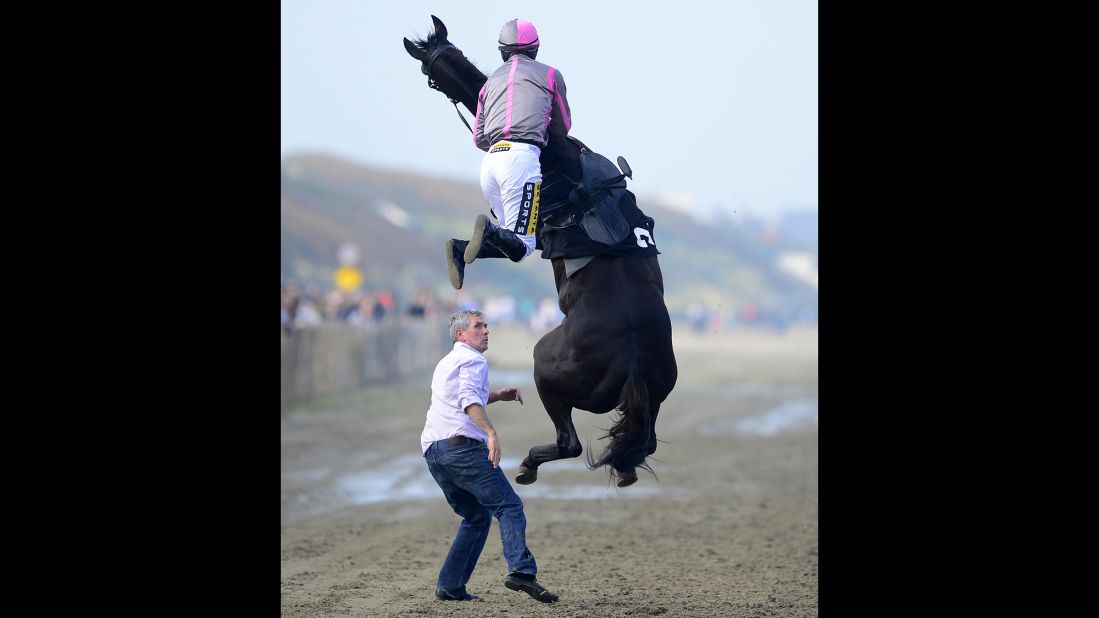 Jockey Johnny King goes flying Thursday, September 4, after mounting Arbitrageur at Laytown Racecourse in Laytown, Ireland. Both the horse and jockey were OK, and they went on to finish in seventh in their race.