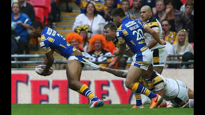 Kallum Watkins of the Leeds Rhinos has his shorts pulled down during the Challenge Cup final, which was played Saturday, August 23, in London. Leeds defeated the Castleford Tigers 23-10.