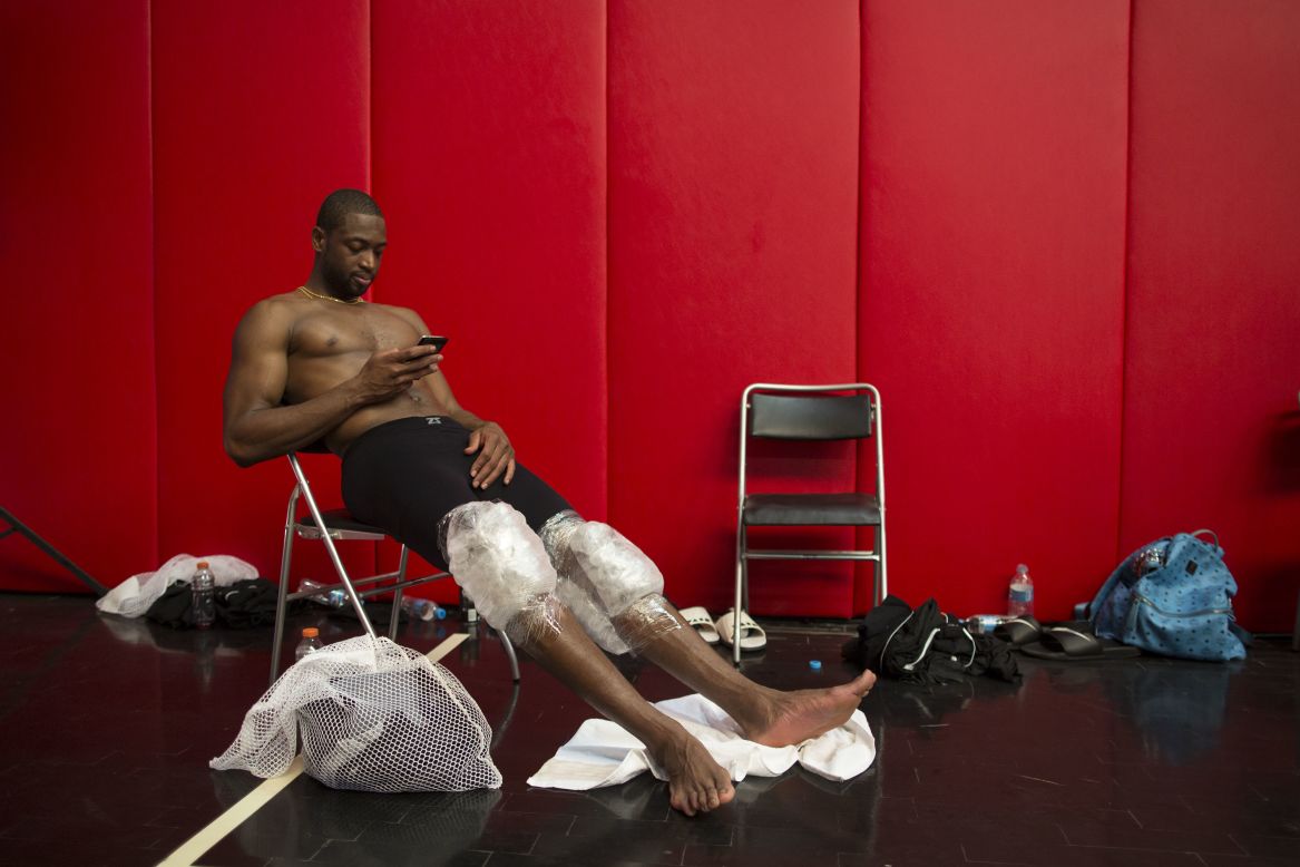 Miami Heat star Dwyane Wade rests after practice Friday, October 10, in Rio de Janeiro. Miami was in Rio to play Cleveland in an NBA preseason game.