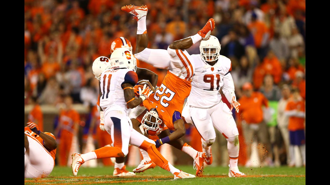 Clemson running back D.J. Howard flips in the air after being hit by a Syracuse player Saturday, October 25, in Clemson, South Carolina.