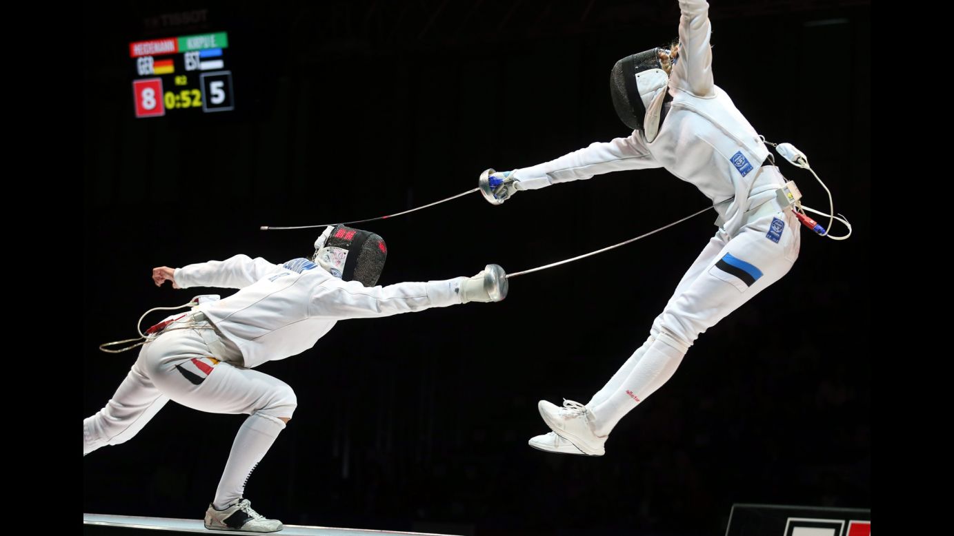 Germany's Britta Heidemann, left, competes against Estonia's Erika Kirpu on Sunday, July 20, during the World Fencing Championships in Kazan, Russia. Heidemann defeated Kirpu in what was the semifinal match of the women's epee event, but she lost to Italy's Rossella Fiamingo in the final.